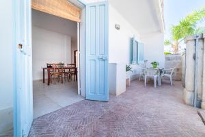 an open door of a house with a dining room at Casa degli Oleandri in Ostuni