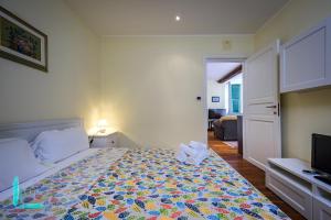 Giường trong phòng chung tại Casa Minni in Boccadasse