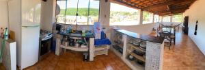 a kitchen with a counter top in a room at Casa my House in Lençóis