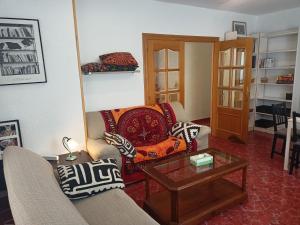 a living room with a couch and a coffee table at Finca La Senorita in Molina de Segura