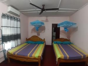 Una cama o camas en una habitación de Amila Guest