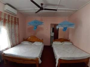 Una cama o camas en una habitación de Amila Guest