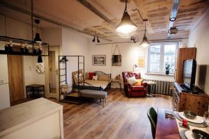 a living room with a couch and a table at 3K Kowalska 16 in Lublin