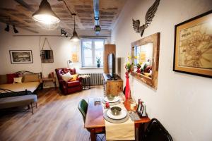 a living room with a table and a living room at 3K Kowalska 16 in Lublin