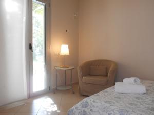 Postel nebo postele na pokoji v ubytování Brunello Seaside Apartments