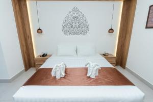 Voodi või voodid majutusasutuse Botum Domrey Hotel toas