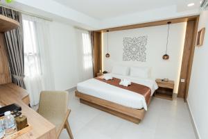 Voodi või voodid majutusasutuse Botum Domrey Hotel toas