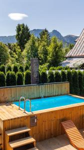 Bazén v ubytovaní Aparthotel Delta Zakopane alebo v jeho blízkosti