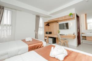 Voodi või voodid majutusasutuse Botum Domrey Hotel toas