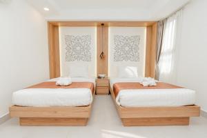 Voodi või voodid majutusasutuse Botum Domrey Hotel toas