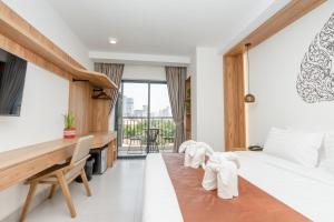 Voodi või voodid majutusasutuse Botum Domrey Hotel toas