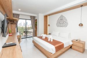 Voodi või voodid majutusasutuse Botum Domrey Hotel toas