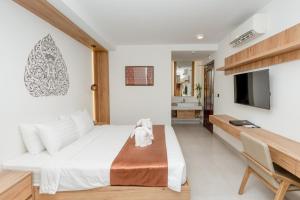 Voodi või voodid majutusasutuse Botum Domrey Hotel toas