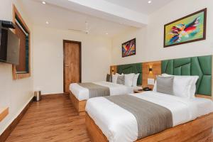 Телевизор и/или развлекательный центр в FabHotel Airport Palace - Nr Mumbai International Airport