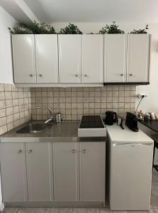 Η κουζίνα ή μικρή κουζίνα στο 27 Urban Stay