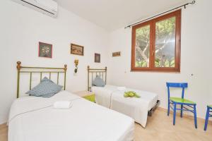 Ένα ή περισσότερα κρεβάτια σε δωμάτιο στο Pineta Azzurra
