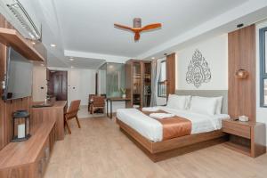 Voodi või voodid majutusasutuse Botum Domrey Hotel toas