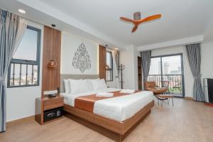 Voodi või voodid majutusasutuse Botum Domrey Hotel toas