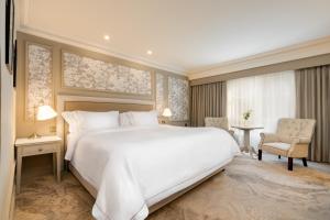 Voodi või voodid majutusasutuse Brooks Hotel toas