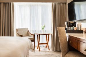 Voodi või voodid majutusasutuse Brooks Hotel toas