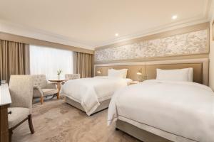 Voodi või voodid majutusasutuse Brooks Hotel toas