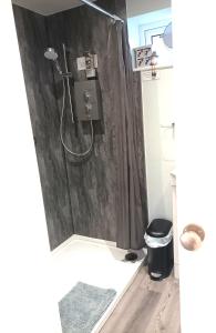 a bathroom with a shower with a shower curtain at Rose View - Modern detached bungalow in Sale