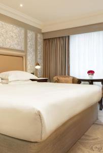 Voodi või voodid majutusasutuse Brooks Hotel toas