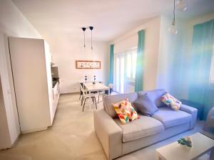 a living room with a couch and a table at il posto giusto - the right place in Anzio