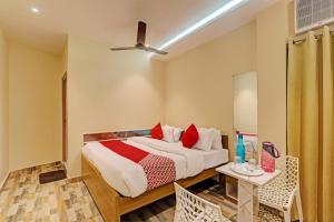 Ένα ή περισσότερα κρεβάτια σε δωμάτιο στο Super Hotel O Royal Regency Palace