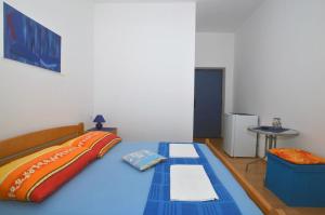 Postel nebo postele na pokoji v ubytování Apartment and Rooms Danica