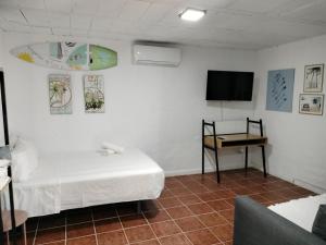 A bed or beds in a room at Villa andaluza relax y playa en entorno tranquilo