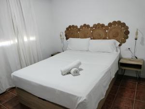 A bed or beds in a room at Villa andaluza relax y playa en entorno tranquilo