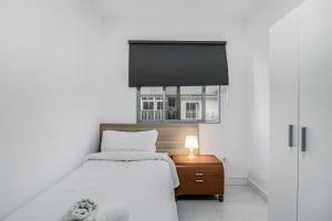 Postel nebo postele na pokoji v ubytování Las Palmas Comfort Rooms + 22 fotografií