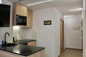 Kuchyň nebo kuchyňský kout v ubytování El Somni de Paqui Apartamentos Boutique Only Adults + 48 fotografií