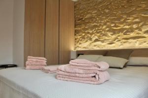 Postel nebo postele na pokoji v ubytování El Somni de Paqui Apartamentos Boutique Only Adults