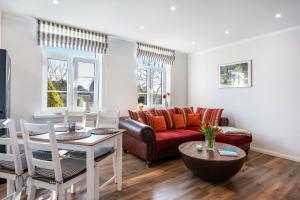 a living room with a couch and a table at Ferienwohnung Alte Schule in Wester-Bargum