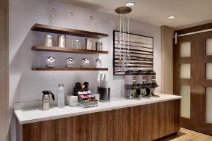 a coffee shop with a counter in a room at Residence Inn by Marriott Brunswick in Brunswick