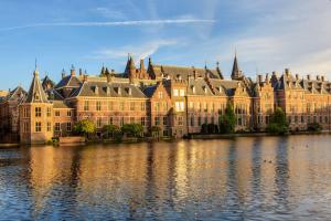 a large building sitting on top of a body of water at Townhouse Den Haag in The Hague