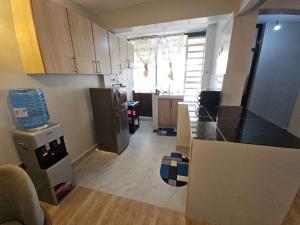 a kitchen with a counter top in a room at Treands Apartments in Nakuru