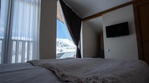 Voodi või voodid majutusasutuse Chalet In Gudauri toas