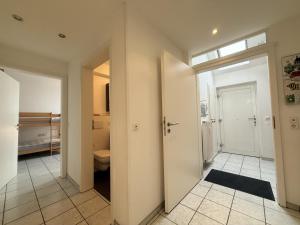 a bathroom with a toilet and a sink at Ferienwohnung Bartling am See in Friedrichshafen