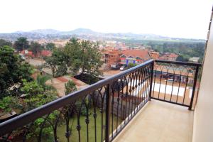 a balcony with a view of a city at ENN Business Hotel in Kampala