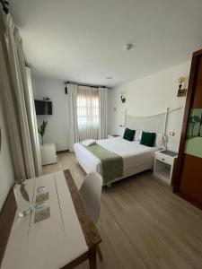 A bed or beds in a room at Posada la Leyenda