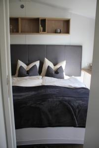 Ein Bett oder Betten in einem Zimmer der Unterkunft Franz Josefs Tinyhäuser
