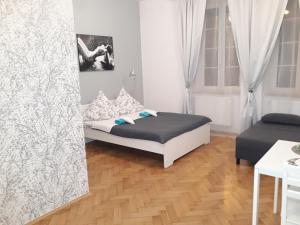 Posteľ alebo postele v izbe v ubytovaní Apartments on Miodowa