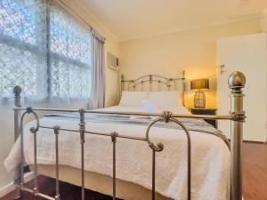 a bedroom with a bed and a window at RetroRhapsody in Gold Coast +70 photos