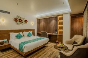 Postel nebo postele na pokoji v ubytování Royal Prime - A City Center Boutique Hotel In Jaipur