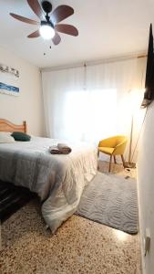 Postel nebo postele na pokoji v ubytování Hospedaje Gandía Centro + 3 fotografie
