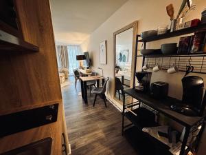 a living room with a table and a dining room at Apartment Schlierseeperle in Schliersee