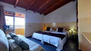 Postel nebo postele na pokoji v ubytování Pensao Porta do Vento